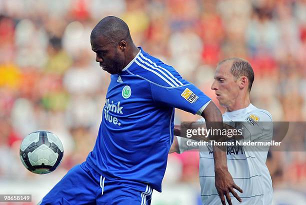 Oliver Barth of Freiburg fights for the ball with Grafite of Wolfsburg during the Bundesliga match between SC Freiburg and VfL Wolfsburg at Badenova...