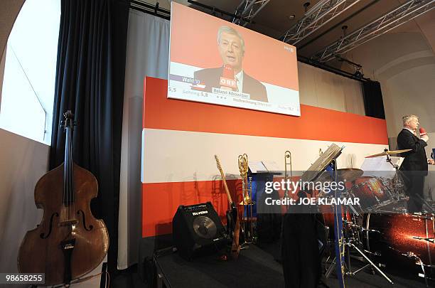 Journalist Roland Adrowitzer of Austrian television ORF speaks to report the first partial results of Austrian presidential election from the...