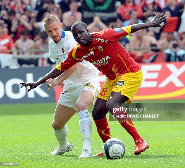 Lens's French forward Gauthier Akale fights for the ball vies a Valenciennes's defender during the French L1 football match Lens vs Valenciennes on...