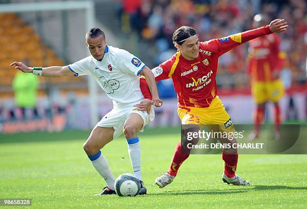 Lens's Serbian midfielder Nenad Kovacenic vies with Valenciennes's midfielder Foued Kadir during the French L1 football match Lens vs Valenciennes on...