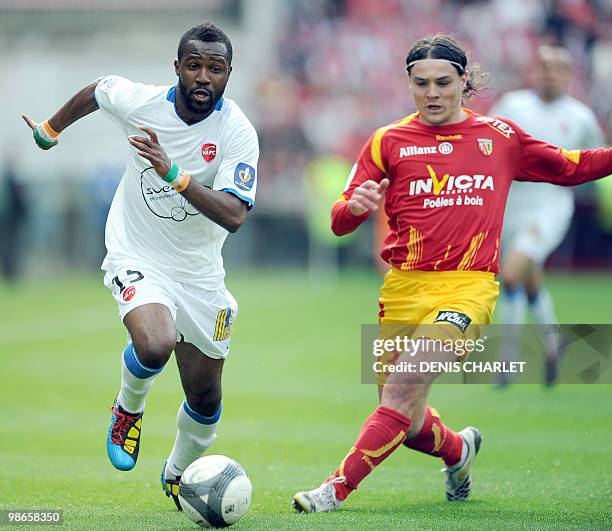 Lens's Serbian midfielder Nenad Kovacevic vies with Valenciennes's Ivoirian defender Siaka Tiene during the French L1 football match Lens vs...