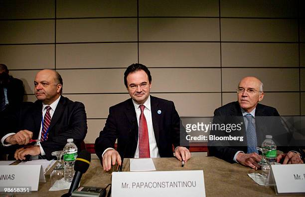 George Papaconstantinou, Greece's finance minister, center, arrives to a news conference with Panagiotis Roumeliotis, Greek representative to the...