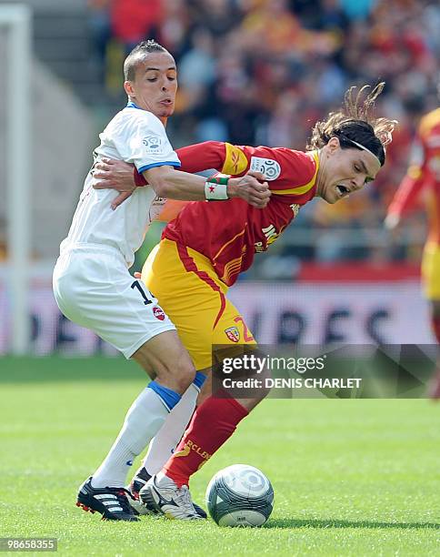 Lens's Serbian midfielder Nenad Kovacenic vies with Valenciennes's midfielder Foued Kadir during the French L1 football match Lens vs Valenciennes on...