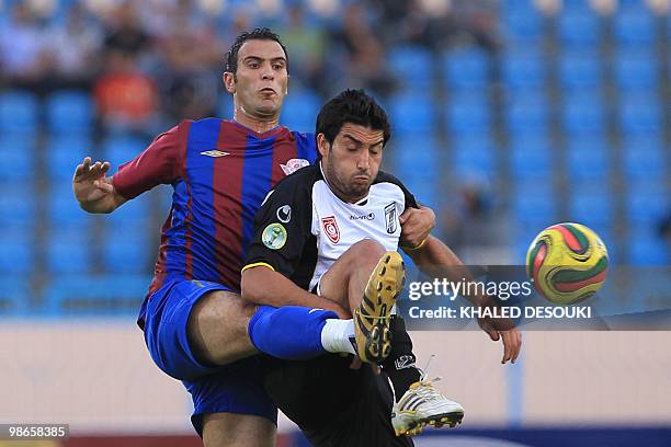 Egypt's Petrojet club player Karim Zekri fights for the ball with Hamza Younes of Tunisia�s CS Sfaxien football team during their African Champions...