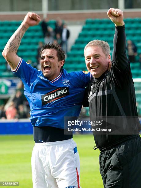 Rangers assistant Ally McCoist and Nacho Novo celebrate winning the league after the Clydesdale Bank Scottish Premier League match between Hibernian...