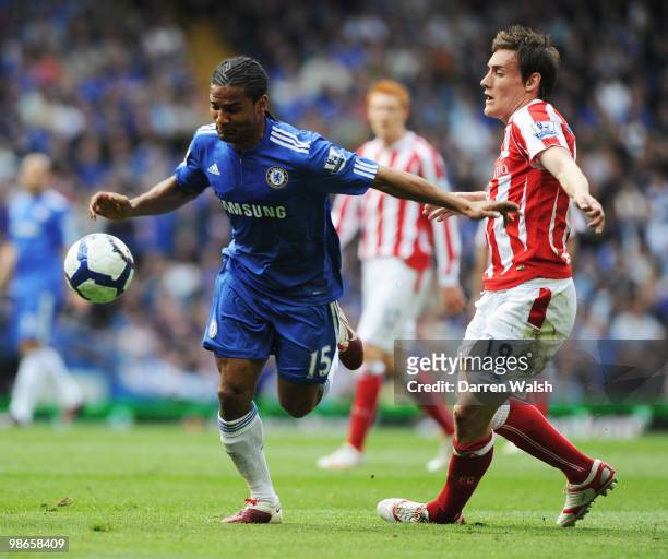 Florent Malouda of Chelsea holds off Dean Whitehead of Stoke City during the Barclays Premier League match between Chelsea and Stoke City at Stamford...