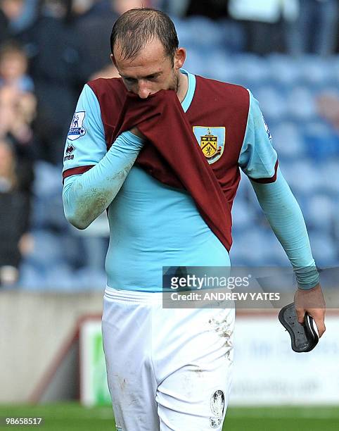 Burnley's Scottish forward Steven Fletcher leaves the pitch after their 4-0 defeat, a result which confirms Burnley's relegation, during the English...