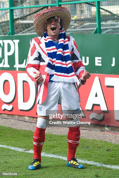 Rangers Nacho Novo celebrates winning the league after the Clydesdale Bank Scottish Premier League match between Hibernian and Rangers at Easter...