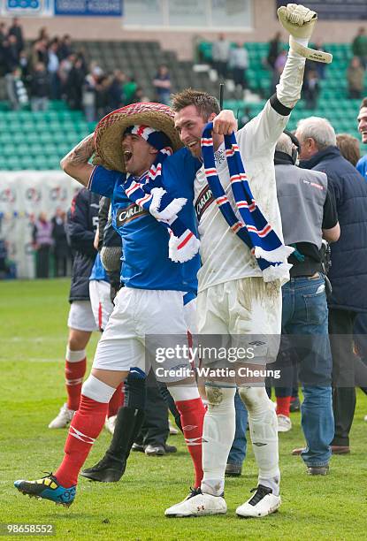 Rangers Allan McGregor and Nacho Novo celebrate winning the league after the Clydesdale Bank Scottish Premier League match between Hibernian and...
