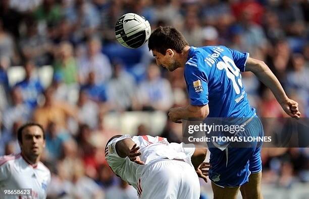 Hoffenheim's Bosnian striker Vedad Ibisevic heads the ball to score the 2-0 against Hamburg during the German first division Bundesliga football...