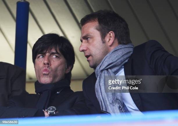 Joachim Loew, head coach of Germany and assistant coach Hansi Flick look on during the Barclays Premier League match between Chelsea and Stoke City...