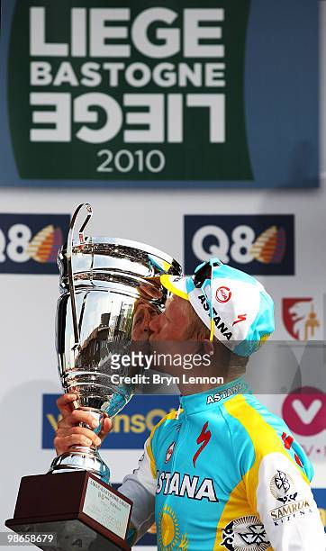 Alexandre Vinokourov of Astana and Kazakhstan poses with the race winners' trophy after winning the 96th Liège-Bastogne-Liège race on April 25, 2010...
