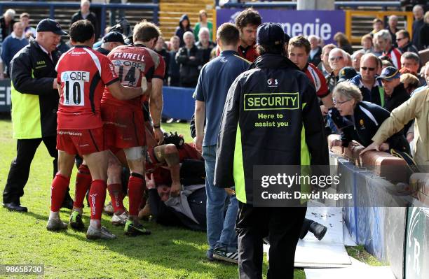 Chris Cracknell of Worcester pulls out father of team mate James Collins after a fracas in the crowd after the Guinness Premiership match between...