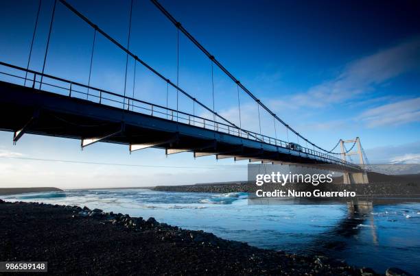 under the bridge and into the sea - nuno guerreiro imagens e fotografias de stock