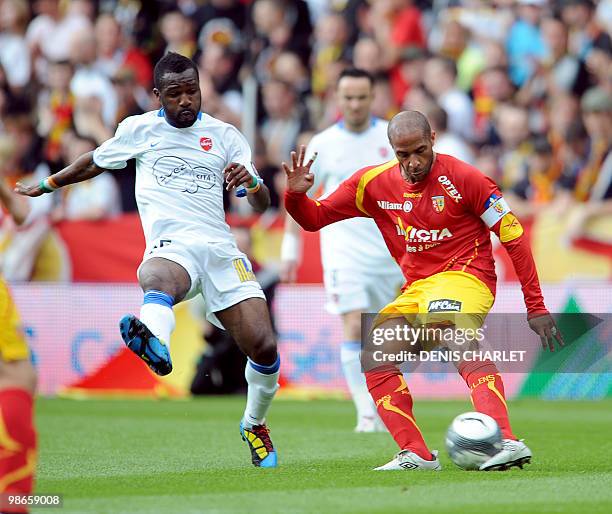Lens's French defender Eric Chelle vies with Valenciennes's Ivorian defender Siaka Tiene during the French L1 football match Lens vs Valenciennes on...