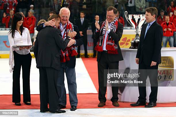 Hans Zach , head coach of Hannover celebrates with Guenter Papemburg, owner of the Hannover Scorpions after winning the DEL play off final match...