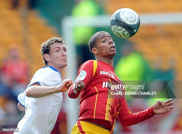Lens's French forward Kevin Monnet-Paquet vies with Valenciennes defender Rudy Mater during the French L1 football match Lens vs Valenciennes on...