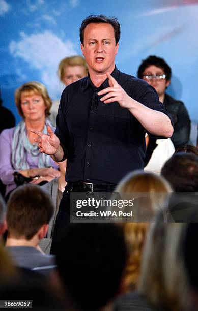 David Cameron, leader of the Conservatives, Britain's opposition party, during a question and answer session at a community meeting in...