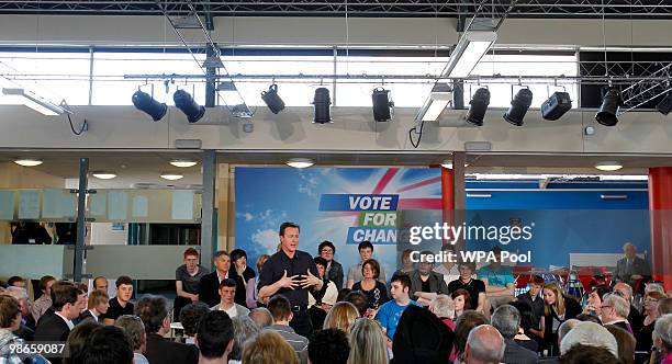 David Cameron, leader of the Conservatives, Britain's opposition party, during a question and answer session at a community meeting in...