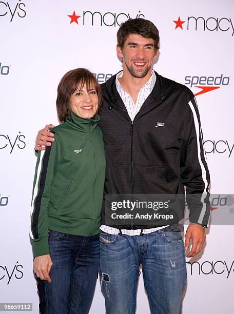 Helen McCluskey, President of the Warnaco Swimwear Group, poses with swimmer Michael Phelps at Macy's Herald Square on April 24, 2010 in New York...