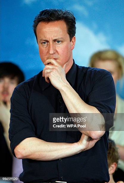 David Cameron, leader of the Conservatives, Britain's opposition party, during a question and answer session at a community meeting in...