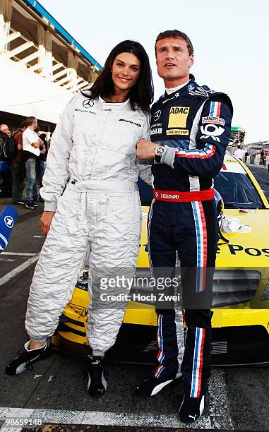 David Coulthard of Great Britain and Mücke Motorsport AMG Mercedes is seen with his wife Karen Minier before the the DTM 2010 German Touring Car...