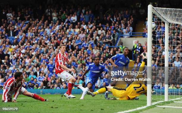 Florent Malouda of Chelsea beats Asmir Begovic of Stoke City to score their seventh goal during the Barclays Premier League match between Chelsea and...