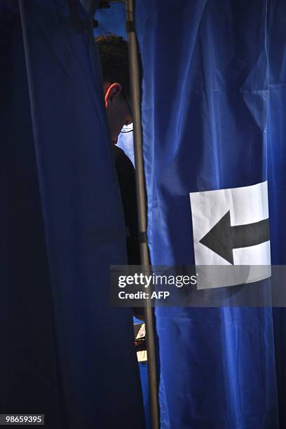 Local man prepares his ballot at a polling station of Budapest on April 25, 2010 during the second round of the general election. A center-right...