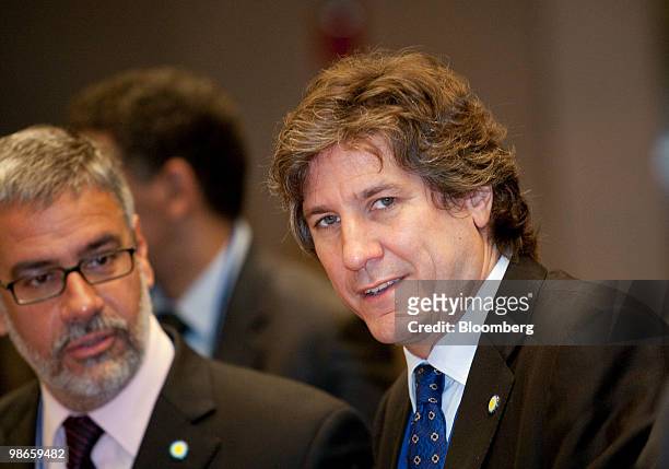 Amado Boudou, economy minister of Argentina, right, talks to Roberto Feletti, vice-president of Banco de la Nacion SA, during the Development...