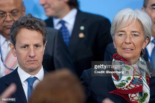 Timothy Geithner, U.S. Treasury secretary, left, and Christine Lagarde, France's finance minister, are arranged for the Development Committee group...