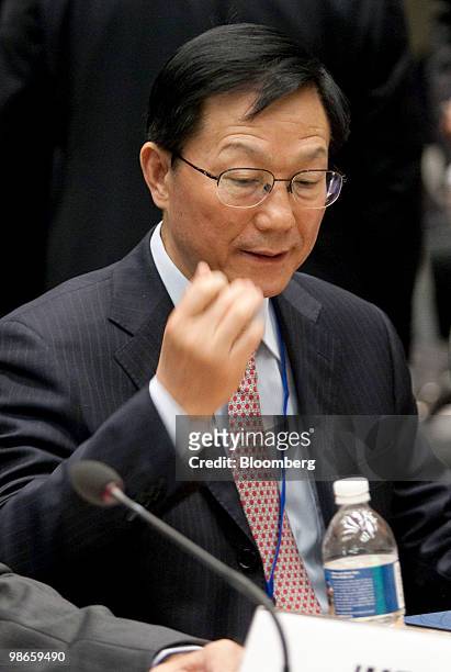 Xie Xuren, China's finance minister, attends the Development Committee meeting of the IMF-World Bank spring meetings with Robert Zoellick, president...