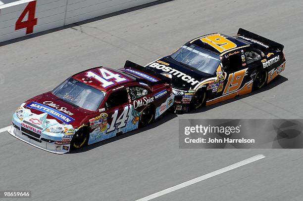 Tony Stewart, driver of the Olds Spice Matterhorn Chevrolet, gets bump drafted by Elliott Sadler, driver of the Stanley/Bostitch Ford, during the...