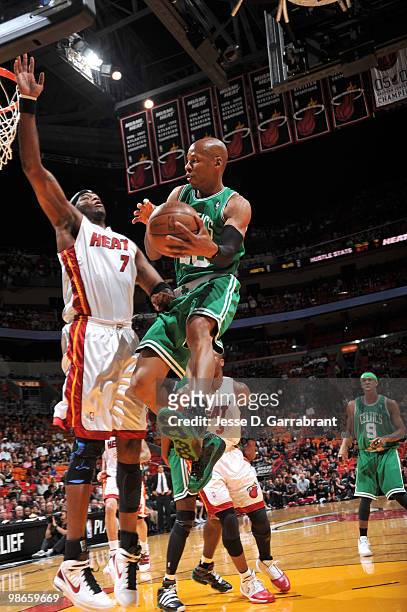 Ray Allen of the Boston Celtics passes against Jermaine O'Neal of the Miami Heat in Game Four of the Eastern Conference Quarterfinals during the 2010...