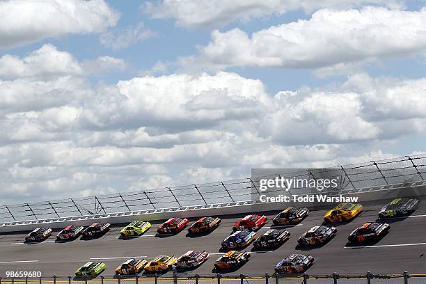 Michael Waltrip, driver of the Aaron's 55th Anniversary Toyota, leads a group of cars during the NASCAR Sprint Cup Series Aaron's 499 at Talladega...
