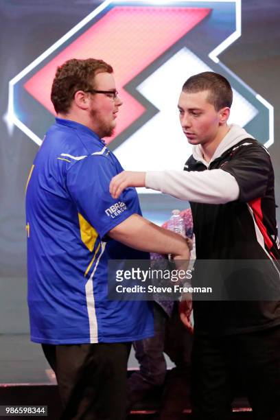 Vert of Warriors Gaming Squad congratulates Mama Im Dat Man of Blazer5 Gaming after game on June 23, 2018 at the NBA 2K League Studio Powered by...