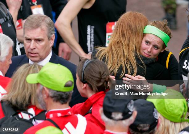 Prince Andrew, The Duke of York stands alongside his daughter HRH Princess Beatrice as she embraces her mother Sarah Ferguson, The Duchess of York...