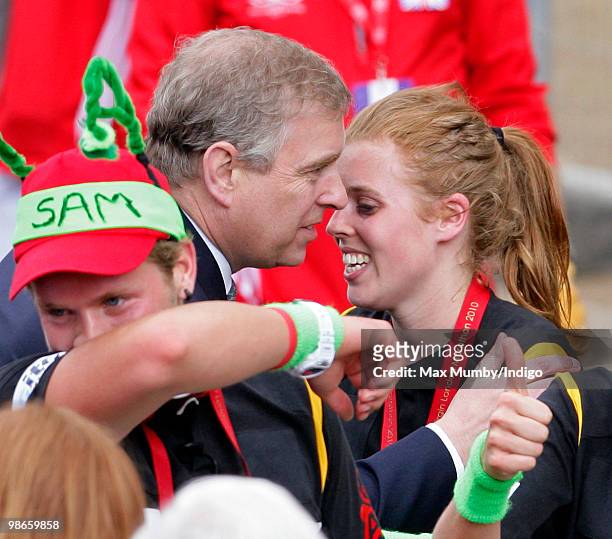 Prince Andrew, The Duke of York talks with his daughter HRH Princess Beatrice after she completes the Virgin London Marathon as part of the...