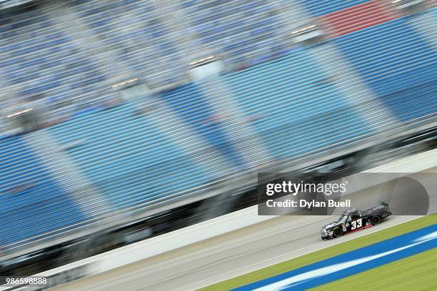 Josh Reaume, driver of the Colonial Countertops Chevrolet, practices for the NASCAR Camping World Truck Series Overton's 225 at Chicagoland Speedway...