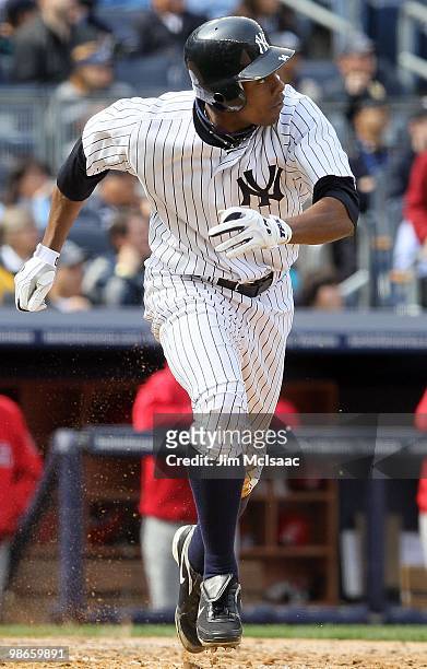 Curtis Granderson of the New York Yankees runs against the Los Angeles Angels of Anaheim during the Yankees home opener at Yankee Stadium on April...
