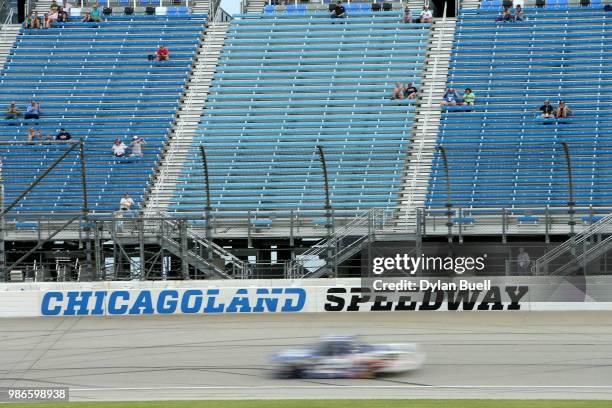 Fans look on as Cody Coughlin, driver of the Jeg's.com Chevrolet, practices for the NASCAR Camping World Truck Series Overton's 225 at Chicagoland...