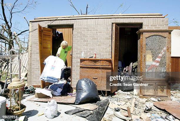 Angie Page collect clothes out of her boyfriends closet on April 25, 2010 in Yazoo City, Mississippi. On Saturday a massive tornado hit the...