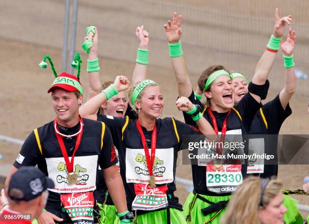 Sam Branson, HRH Princess Beatrice of York, Holly Branson and Dave Clark celebrate after completing the Virgin London Marathon as part of the...