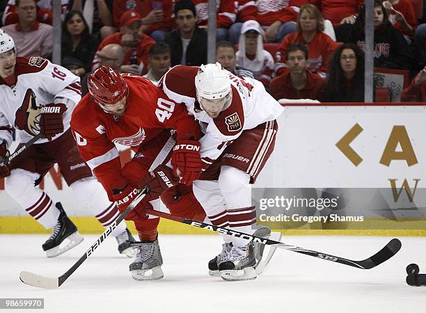 Matthew Lombardi of the Phoenix Coyotes battles for the puck with Henrik Zetterberg of the Detroit Red Wings during Game Six of the Western...