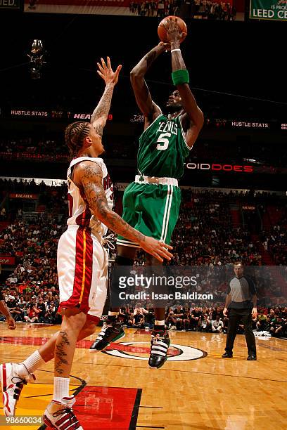 Kevin Garnett of the Boston Celtics shoots against Michael Beasley of the Miami Heat in Game Four of the Eastern Conference Quarterfinals during the...