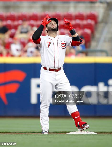 Eugenio Suarez of the Cincinnati Reds celebrates after hitting a double in the third inning against the Milwaukee Brewers at Great American Ball Park...