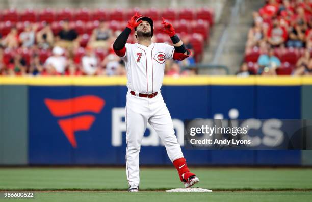 Eugenio Suarez of the Cincinnati Reds celebrates after hitting a double in the third inning against the Milwaukee Brewers at Great American Ball Park...