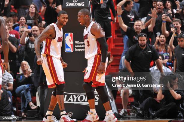 Dwyane Wade and Dorell Wright of the Miami Heat celebrate against the Boston Celtics in Game Four of the Eastern Conference Quarterfinals during the...