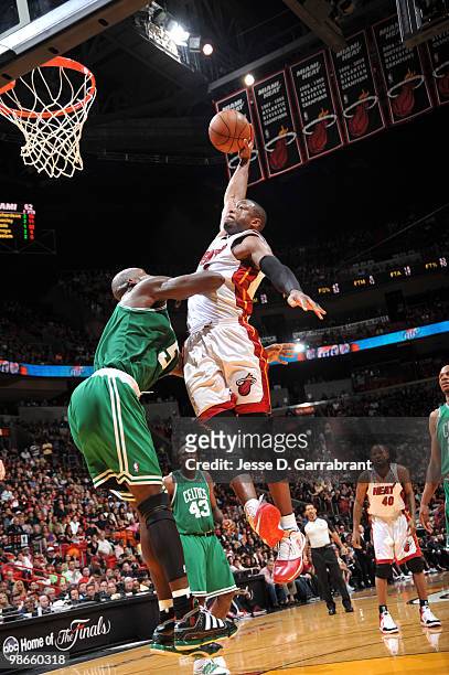 Dwyane Wade of the Miami Heat dunks against Kevin Garnett of the Boston Celtics in Game Four of the Eastern Conference Quarterfinals during the 2010...