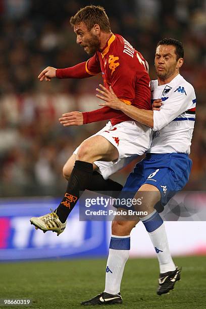 Daniele De Rossi of AS Roma and Luciano Zauri of UC Sampdoria in action during the Serie A match between AS Roma and UC Sampdoria at Stadio Olimpico...