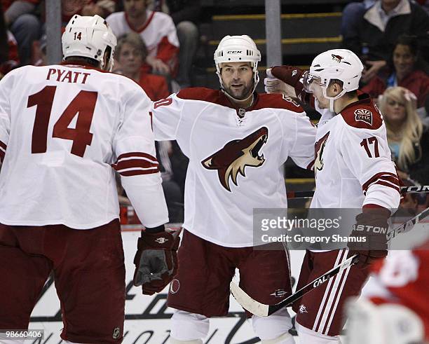 Radim Vrbata of the Phoenix Coyotes celebrates his second period goal with Robert Lang and Taylor Pyatt while playing the Detroit Red Wings during...